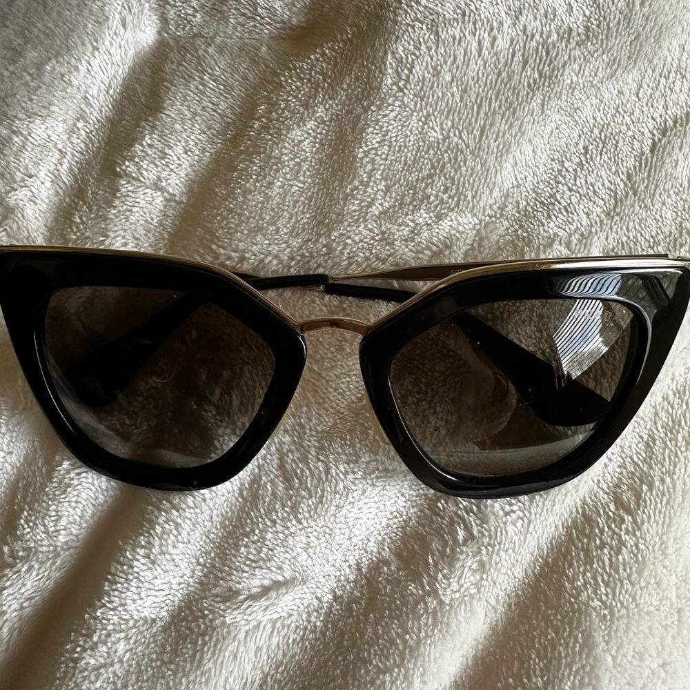 Prada cat eye black sunglasses. Comes with box and case.